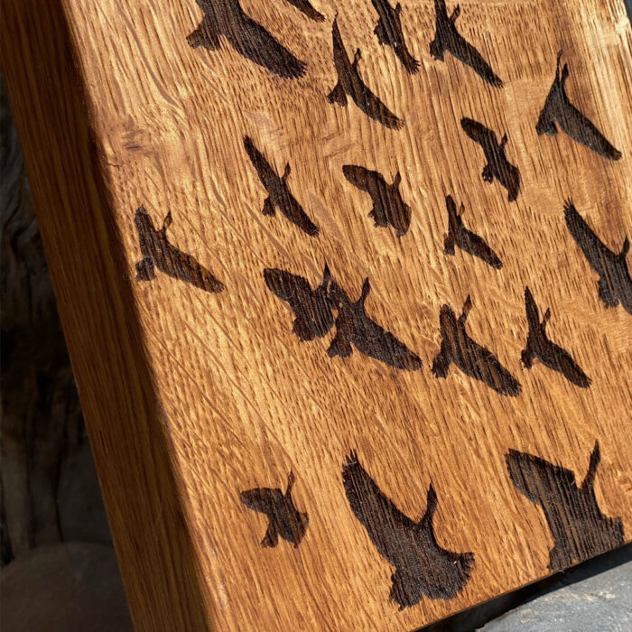 oak black resin flock of geese motif chopping board